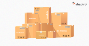 Stack of boxes with the words de minimis on them