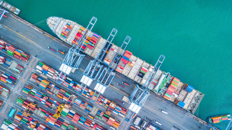 cargo ship being loaded at a port